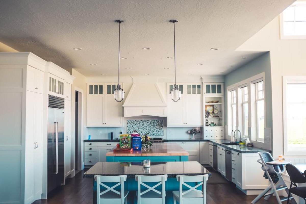 Bright residential kitchen with built-in appliances